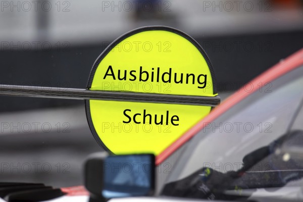 (Photomontage) Training Symbol image: Lollipop in motorsport with modified text Training / School