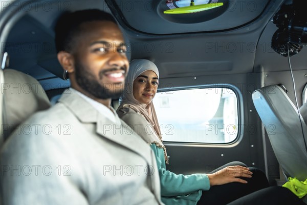 Business partners smiling while sitting in a private airplane, enjoying comfortable and efficient transportation