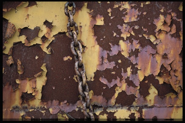 Rusty chain on an old steel wall, Bavaria, Germany