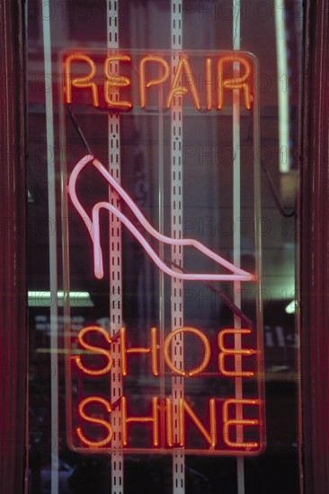 Illuminated advertising Shoe Repair in a shop, New York City, USA