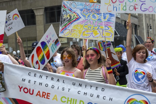 Detroit, Michigan USA - 8 June 2025 - Gay, lesbian, bisexual, and transgender activists and their allies marched for equality in the Motor City Pride parade. A group from Central United Methodist Church joined the parade