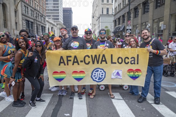 Detroit, Michigan USA - 8 June 2025 - Gay, lesbian, bisexual, and transgender activists and their allies marched for equality in the Motor City Pride parade. Members of the Association of Flight Attendants joined the parade