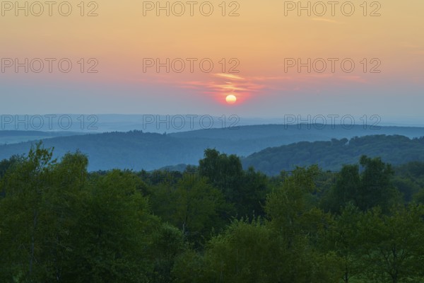 Pink sunset over wooded hills, quiet evening atmosphere, Geishöhe, Dammbach, Spessart, Bavaria, Germany