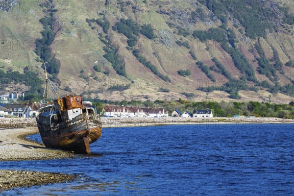 Corpach Wreck or Old Boat of Caol and Nevis Range Mountains, Caol Beach, Corpach, Fort William, Highland, Scotland, UK