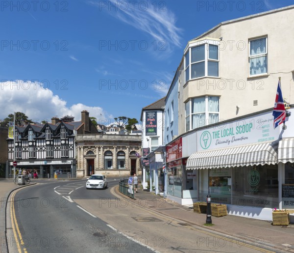 Shops in street of historic buildings, Piermont Place, Dawlish, south Devon, England, UK