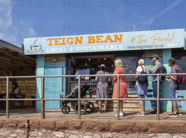 People queuing at Teign Bean cafe, Eastcliff, Teignmouth, south Devon, England, UK