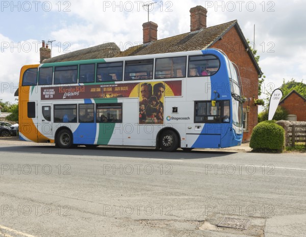 Stagecoach double decker Scania Enviro400 bus at bus stop, village of Avebury, Wiltshire, England, UK