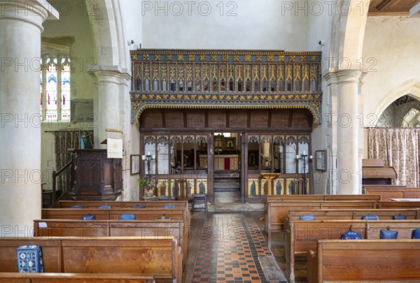 Rood screen and nave inside village parish church of Saint James, Avebury, Wiltshire, England, UK