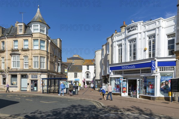 Street and shops including WH Smith in town centre of Teignmouth, south Devon, England, UK