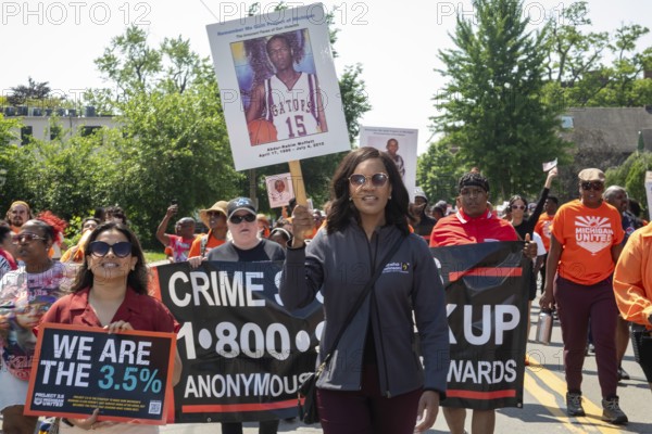 Detroit, Michigan - Silence the Violence, a march against gun violence organized by the Church of the Messiah. Detroit City Council member Latisha Johnson carries a poster of a young man killed by gun violence