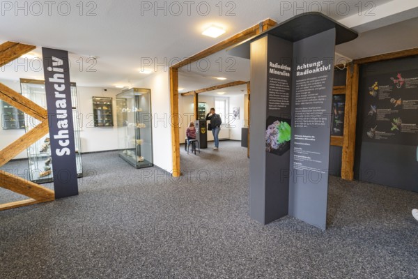 Interior of a mineral museum with information panels on radioactive materials, family festival in Neubulach, district of Calw, Germany