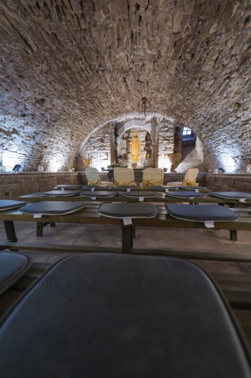 Vaulted cellar with sculpture, surrounded by stone walls and illuminated, sacred ambience, registry office, family celebration in Neubulach, district of Calw, Germany