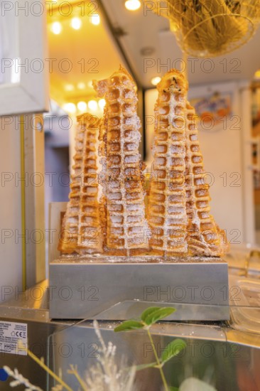 Fresh waffles with icing sugar at a market stall, Calw railway station festival, Black Forest, Germany