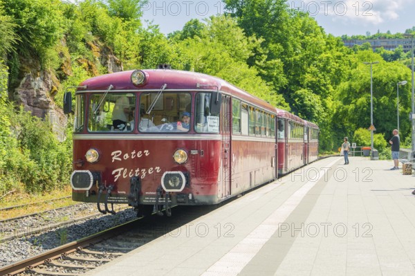 Close-up of a red train on a sunny platform, Calw railway station festival, Black Forest, Germany