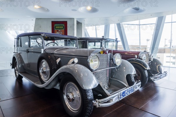 Mercedes-Benz 770 Large Mercedes Cariolet F from 1932, driven by the former German Kaiser Wilhelm II in his exile in Holland. The Hohenzollern coat of arms on the radiator instead of the Mercedes star. The Mercedes-Benz Museum in Stuttgart presents a journey through the automotive history of the global corporation. Collection 4, Gallery of Names. The history of the Mercedes star begins with the first automobile in 1886. 160 vehicles are on display. Stuttgart, Baden-Württemberg, Germany