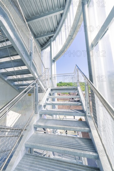 Modern metal staircase structure with glass walls and plenty of daylight, Zob extension with bridge construction for the new Herman Hesse railway, Calw, Black Forest, Germany