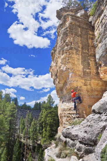 Man climbing canyon wall, Flagstaff, Arizona, USA