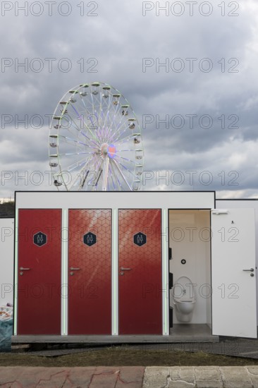 Toilets in front of the Ferris wheel at the Rock am Ring Festival on Sunday, Nürburgring race track race track, 08.06.2025