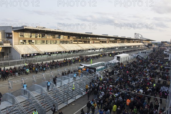 Festival visitors stream via separate entrances to the front breakwaters in front of the Utopia Stage at the Rock am Ring Festival on Sunday, Nürburgring race track race track, 08.06.2025