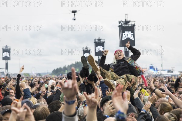 Festival visitor crowdsurfing at the Rock am Ring Festival on Friday, Nürburgring race track race track, 07.06.2025