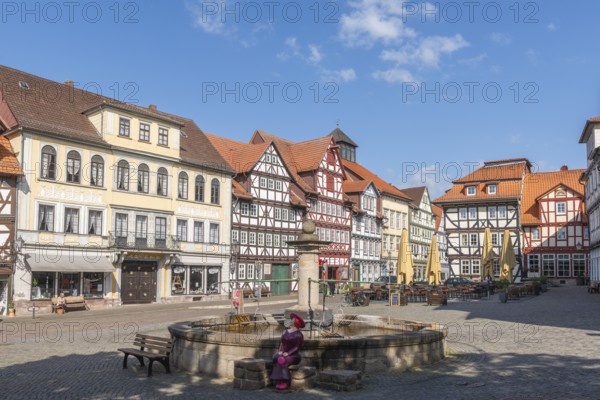 Bad Sooden, Allendorf, Allendorf district, historic old town with numerous half-timbered houses under monument protection, gabled houses, eaves house, market square with fountain and female figure, bench, sunshades, cobblestones, Werra, blue sky, clouds, Meissner district, Hesse, Germany