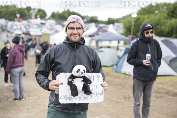Festival visitor with panda (#Propagandapanda) on a campsite at the Rock am Ring Festival on Saturday, Nürburgring race track race track, 07.06.2025