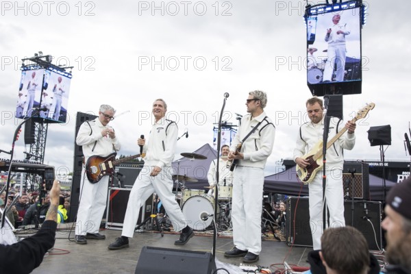 Steffen Israel (guitarist and keyboarder), Felix Brummer (singer), Karl Schumann (guitarist) and Till Brummer (bassist) of Kraftklub at a secret gig of the band at the Rock am Ring Festival on Saturday, Nürburgring race track race track, 07.06.2025