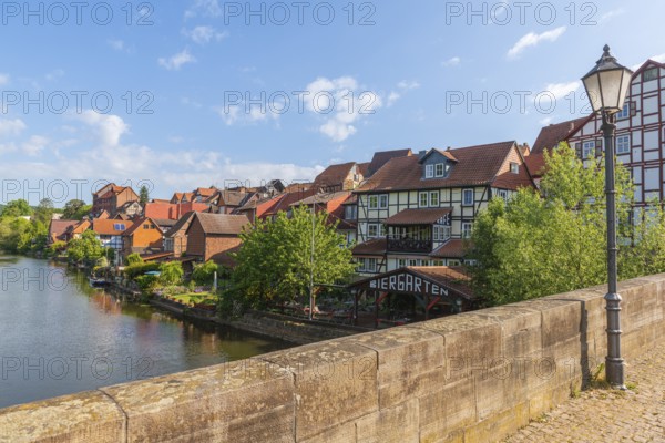 Old fishermen's settlement along the Werra, Bad Sooden, Allendorf, district Allendorf, street Fischerstad under monument protection, half-timbered houses, bridge, lantern, trees, blue sky, Werra-Meissner-Kreis, Hesse, Germany