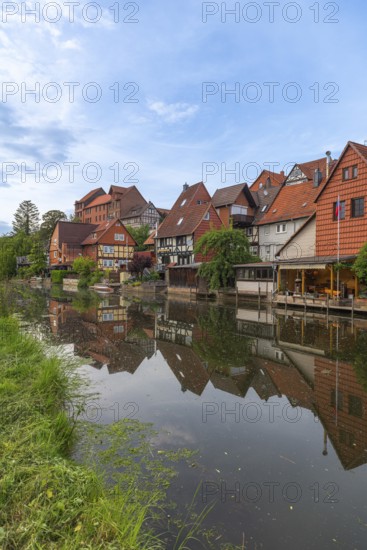 Old fishermen's settlement along the Werra, Bad Sooden, Allendorf, district Allendorf, street Fischerstad under monument protection, half-timbered houses, water reflection, veranda, trees, blue sky, Werra-Meissner-Kreis, Hesse, Germany