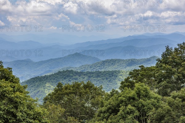 Smoky haze over the foliage on the mountainsides along the Blue Ridge Parkway in the Smoky Mountains near Cherokee, North Carolina, USA