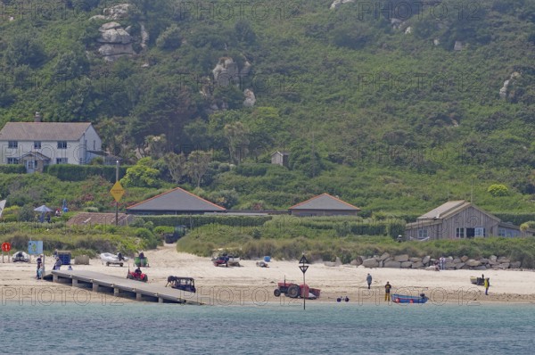 Coastal landscape with beach, houses and green hills in the background, relaxed atmosphere, Isles of Scilly, Cornwall, England, Great Britain