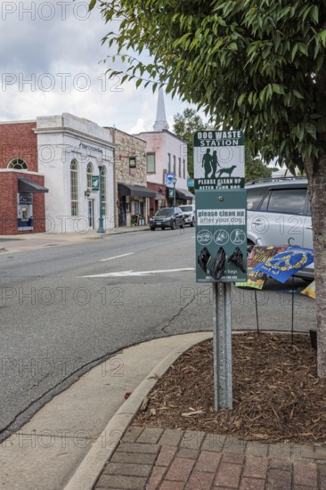 Dog waste station with bags for cleaning up after your dog in downtown Sylva North Carolina, USA