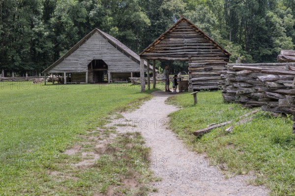 Historic log buildings at the Oconaluftee Visitor Center at Great Smoky Mountains National Park near Cherokee, North Carolina, USA