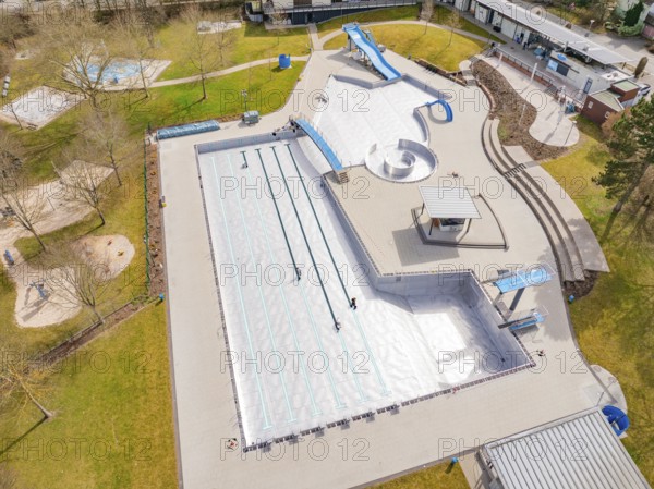 Wide aerial view of the swimming pool with various leisure structures and lawn, renovation of the swimming lines, Calw Stammheim outdoor pool, Calw, Black Forest, Germany