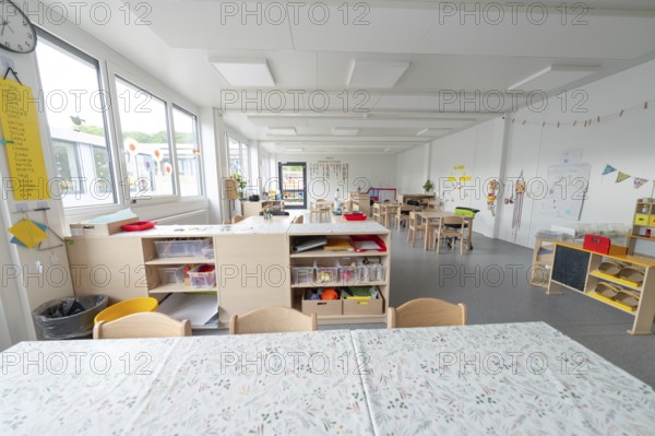 Spacious kindergarten with shelving and table groups for activities, transitional containerised daycare centre, Gechingen daycare centre, Calw district, Germany