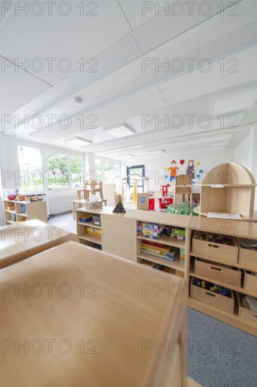 Versatile and bright room with furniture, shelves and toys, transitional daycare centre in container construction, Gechingen daycare centre, Calw district, Germany
