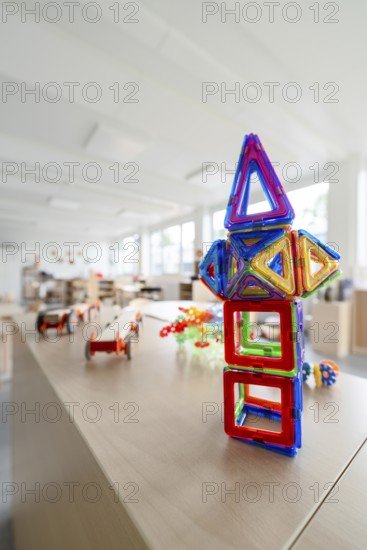 Colourful geometric toys on a table in a kindergarten, transitional daycare centre in container construction, Gechingen daycare centre, Calw district, Germany