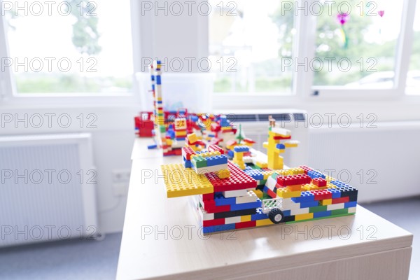 Colourful Lego models on a table in front of a sunny window, transitional daycare centre in container construction, Gechingen daycare centre, Calw district, Germany