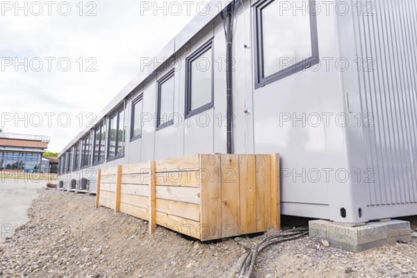 Side view of a modular building with timber panelling and windows, transitional daycare centre in container construction, Gechingen daycare centre, Calw district, Germany