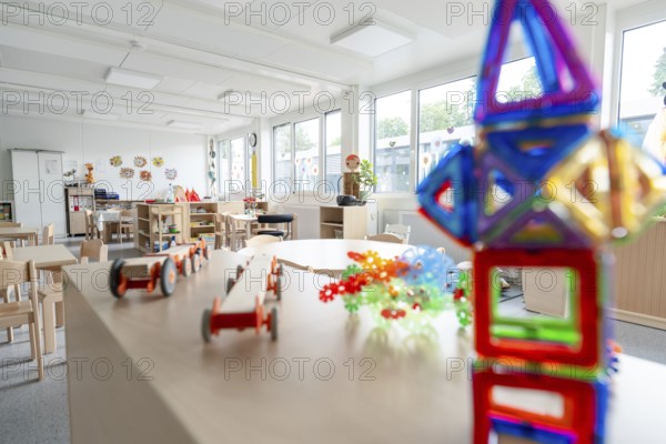 Colourful kindergarten room with toys and large windows, flooded with light, transitional kindergarten in container construction, Gechingen kindergarten, Calw district, Germany