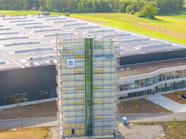 Industrial building with green surroundings and scaffolding, equipped with solar system, ING Park development area, Zweckverband INGpark Nagold Gäu, Boysen, Nagold, Germany