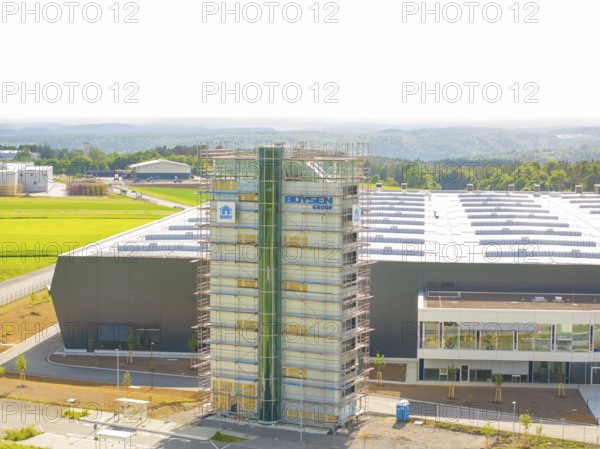 Front view of an industrial building with scaffolding and fields in the background, ING Park development area, Zweckverband INGpark Nagold Gäu, Nagold, Germany