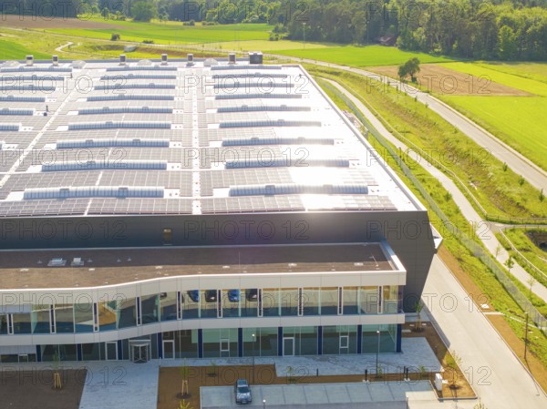Roof of a large building with solar modules, surrounded by rural landscape, ING Park development area, Zweckverband INGpark Nagold Gäu, Nagold, Germany