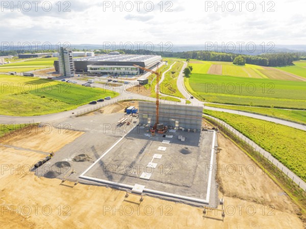 Extensive construction site in a rural area with construction vehicles and crane, ING Park development area, Zweckverband INGpark Nagold Gäu, Nagold, Germany