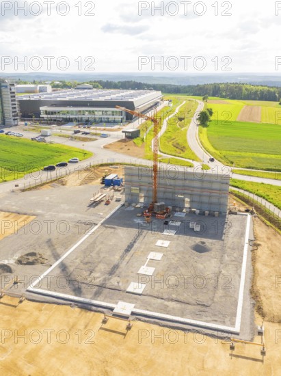 Large construction site with crane and unfinished structure in a rural setting, ING Park development area, Zweckverband INGpark Nagold Gäu, Nagold, Germany