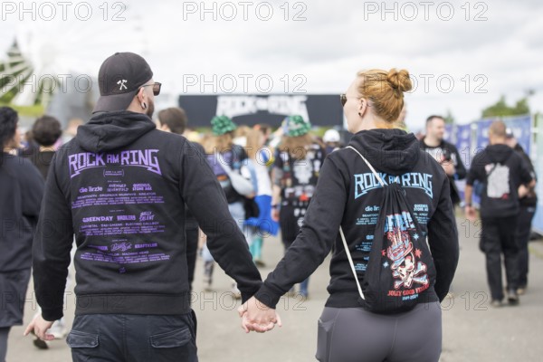 Two festival visitors with Rock am Ring jumpers at the Rock am Ring Festival on Friday, Nürburgring race track race track, 06.06.2025