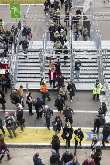 Festival visitors pass through a lock to get into the first breakwater at the Rock am Ring Festival on Friday, Nürburgring race track race track, 06/06/2025