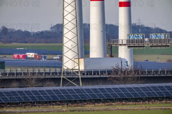 86.5 MW peak open space photovoltaic systems, from RWE, with over 141, 000 solar modules, on a side strip, over 1 km long, along the A44 motorway near Bedburg, at the Jackerath triangle, recultivated open-cast mining site, wind farm north of Titz, North Rhine-Westphalia, Germany