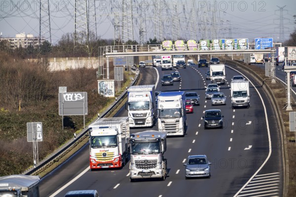 A57 motorway near Kaarst in the Rhein-Kreis Neuss, view towards Kaarst motorway junction, direction Cologne, heavy traffic, overhead line, high-voltage lines, along the motorway, North Rhine-Westphalia, Germany