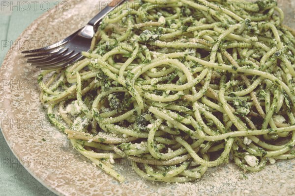 Spaghetti with pesto sauce, homemade, no people